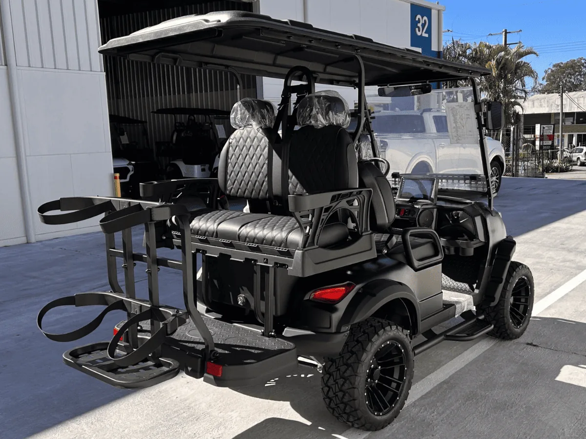 Golf bag rack installed behind the rear seats of a JSH cart