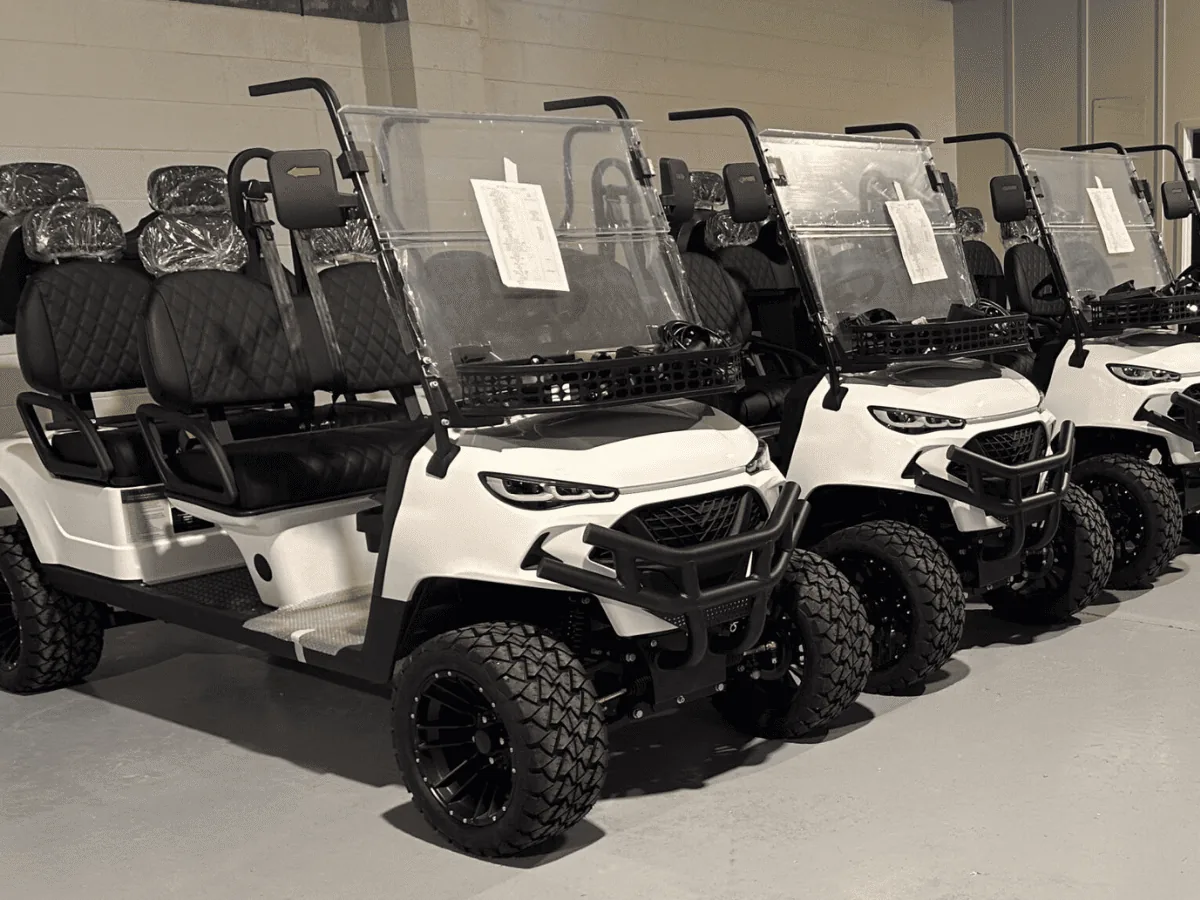 Rows of assembled white JSH golf carts in Australia