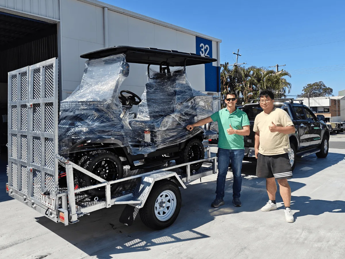 JSH and Voltev team members with a locally delivered golf cart in Narangba