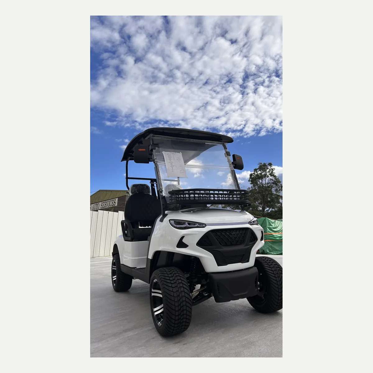 White JSH0701 two-seat golf cart from the front quarter