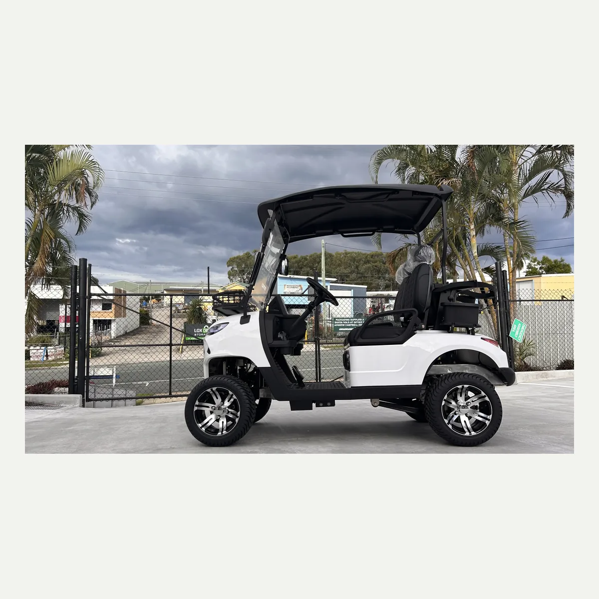 White JSH0701 two-seat golf cart in side profile