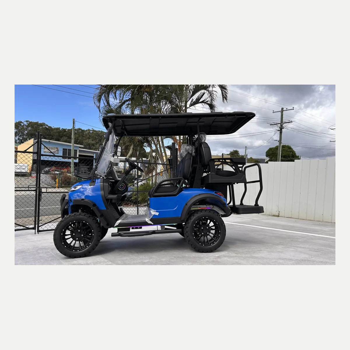 Blue JSH0702 lifted 2+2 golf cart in side profile