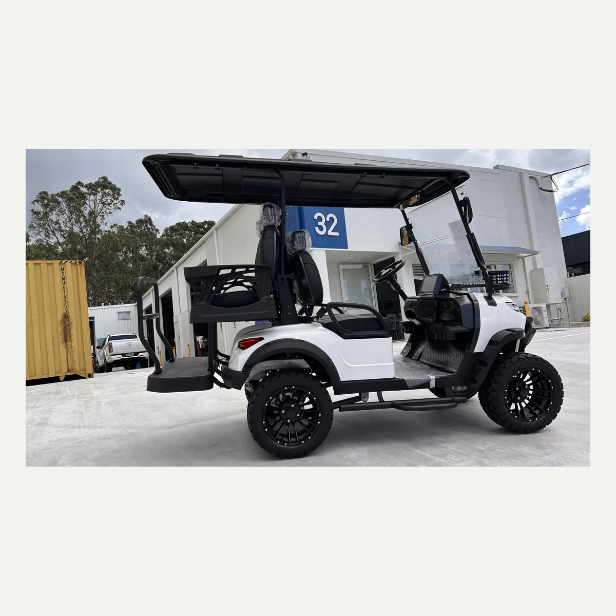 White JSH0702 lifted 2+2 golf cart in side profile