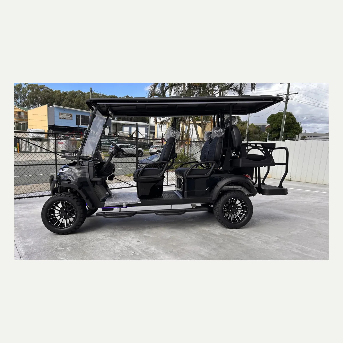 Black JSH0704 lifted 4+2 shuttle buggy in side profile